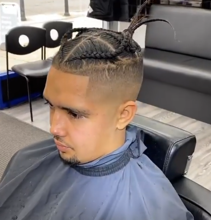 Braided hairstyle with a clean skin fade